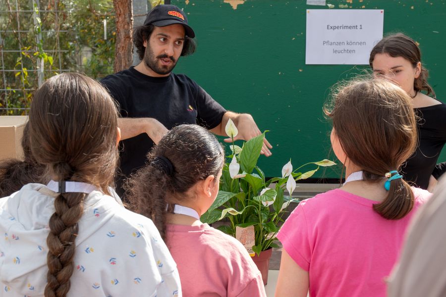 Children listen to a lecture about plants